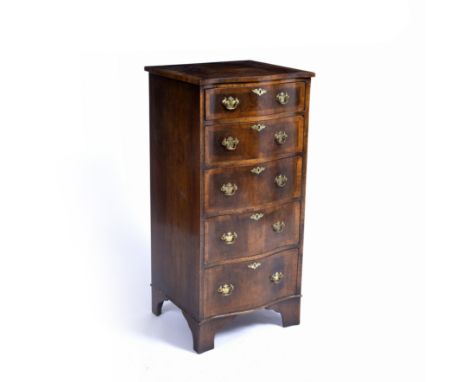 An old reproduction serpentine pillar chest of five long drawers with brass handles, bracket feet and crossbanded top, 105cm 