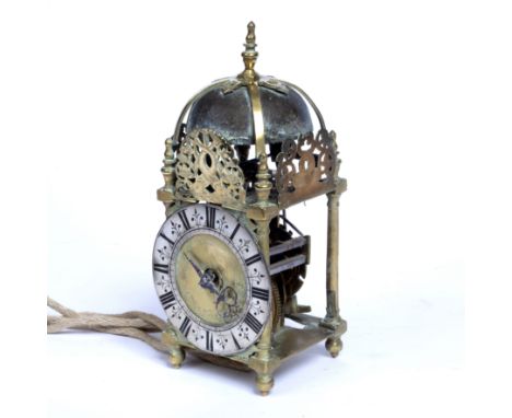 A late 17th century brass lantern clock, the applied silvered roman chapter ring with trident half hour markers, the centre f