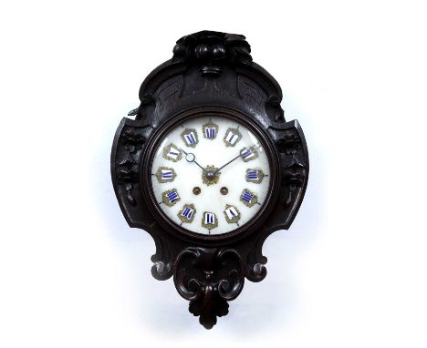 A late 19th century French oak wall clock, the alabaster dial with applied gilt metal and enamel numerals, the shaped case wi