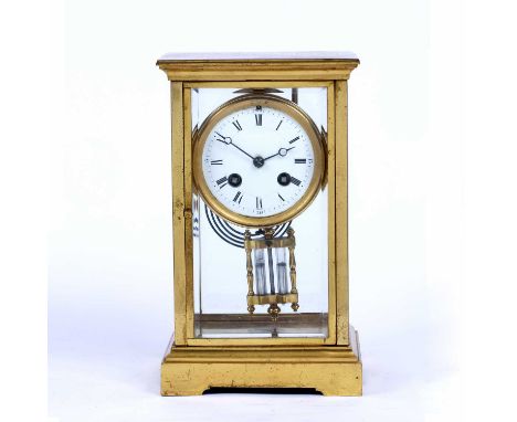 A late 19th century brass four glass mantel clock, with circular white enamel dial, the movement with mercury pendulum, the c
