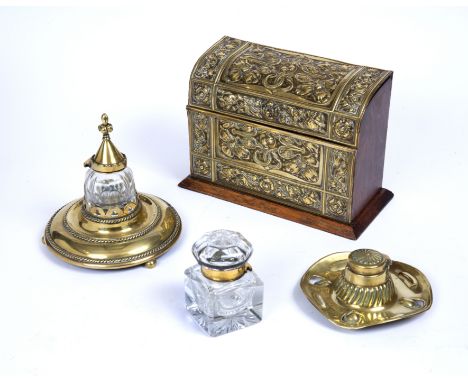 A late 19th Century brass mounted oak stationery box, embossed with stylised sinuous foliage, and having fitted interior, 21.