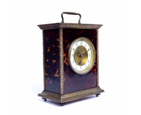 A 19th century French tortoiseshell and gilt metal mounted mantel timepiece with white enamel dial and carrying handle, 25cm 