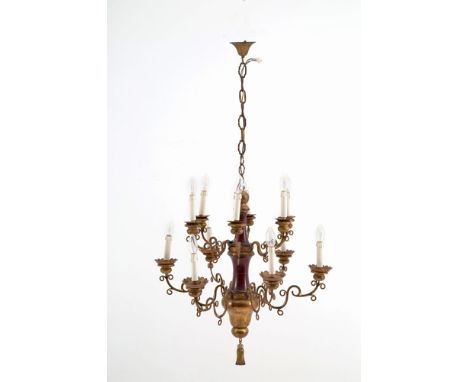 Chandelier on two levels in lacquered and gilded wood with twelve arms in gilded iron. 70x70 cm approx. Lampadario su due pal