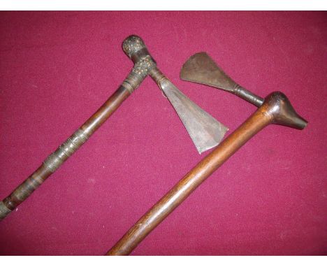Two tribal hand axes, the first with metal bound detail and tapering form axe head with etched decoration - length 6 inches, 