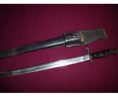 Remington 1913 bayonet, the blade stamped 1913 1 17 Remington, complete with leather scabbard and frog stamped 1102TR 6286 