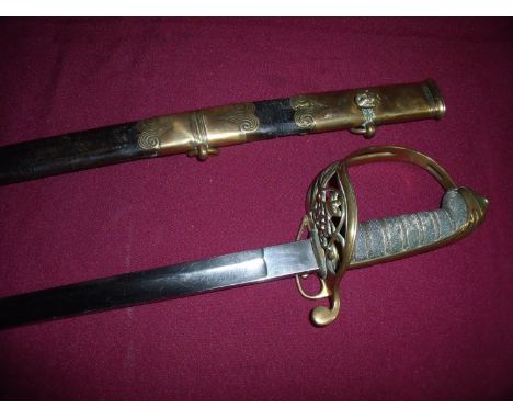 British officers 1945 pattern sword with 31.5 inch single fullered blade with etched crowned VR and floral detail, with pierc