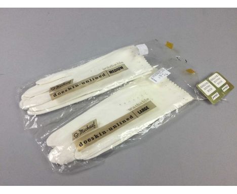 TWO PAIRS OF WHITE DOESKIN GLOVES,St Micheal unlined doeskin, in sizes medium and large, along with two vintage Wallis trench