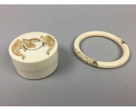 JAPENESE IVORY BOX AND COVER,Meiji period (1868-1912), the cover decorated with monkeys, 6.5cm diameter, along with a Japanes