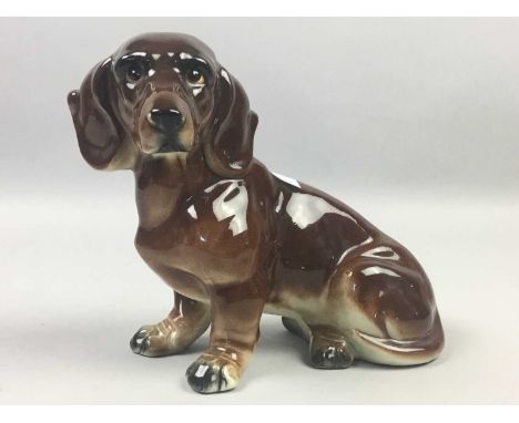 CERAMIC FIGURE OF A DACHSHUND,22cm wide, along with another ceramic animal figures including a Sylvac bear, also including a 