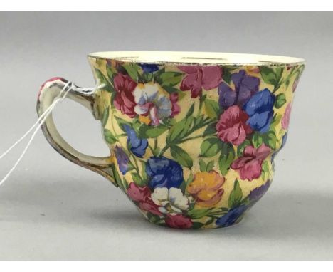CHINTZ TEA WARE,comprising two tea cups and three biscuit plates, along with various other handpainted Continental ceramics b