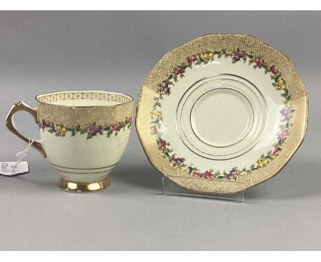PLANT TUSCAN PART TEA SERVICE,with floral and gilt decoration on cream grounds
