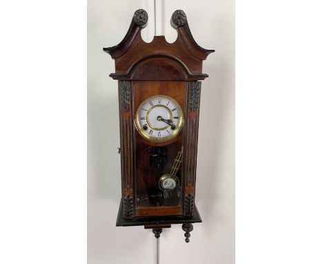 MAHOGANY WALL CLOCK,with swan neck pediment over a white enamel brass dial, with striking movement and brass pendulum, 61cm h