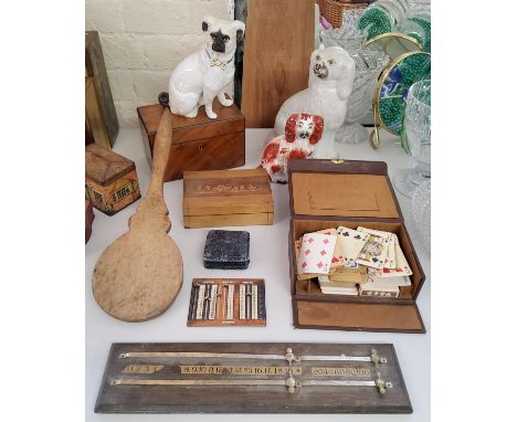 A Regency walnut tea caddy c.1820; a carved cigarette box, cedar wood lined, decorated with classical charioteering putti; Mo