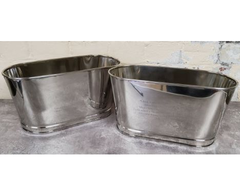 A pair of oval champagne/wine ice buckets, one side etched with Napoleon's family crest above 'I drink champagne when I win ,