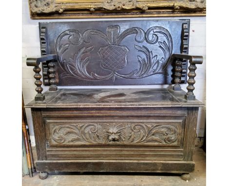 An early 20th century carved oak monks bench c.1930 