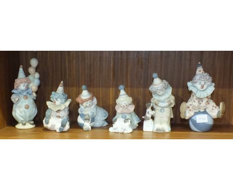 A collection of six unboxed Lladro clown figures, including playing a concertina, holding balloons, seated on a ball, etc, ta