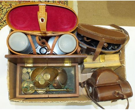 A Braun 'Gloria' camera, a set of scales and brass weights in mahogany box, a pair of Lumiere, Paris 8x25 binoculars in case 