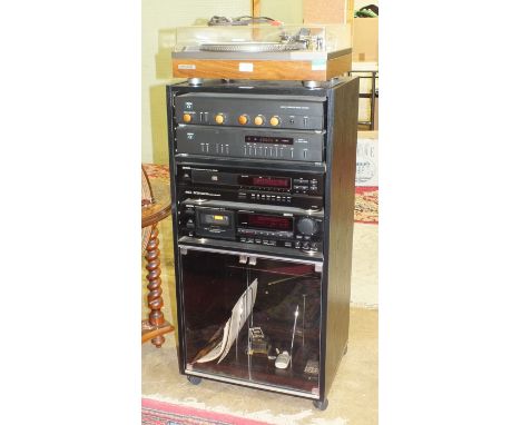A Hi-Fi system comprising a Pioneer PL-510A turntable, Arcam Alpha 3 amplifier and tuners, a Denom DCD-890 CD player, a Denom