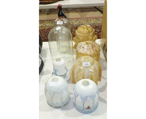 A Masons Table Waters Co. glass soda siphon, six glass lamp shades and a glass dome, 25cm high, base 14cm diameter.