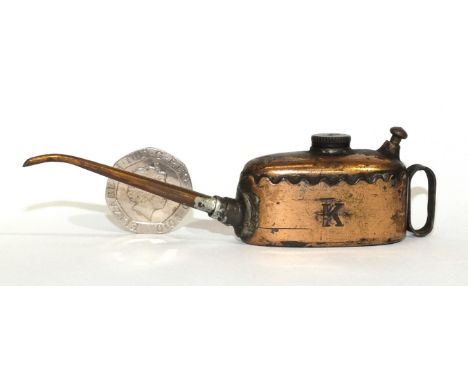 A Meccano copper oil can marked K to one side and Meccano to base, 2.6cm high.