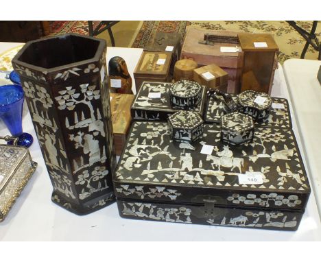 A collection of mother-of-pearl-inlaid lacquered boxes, parquetry boxes, a Mah Jong set and miscellaneous items.