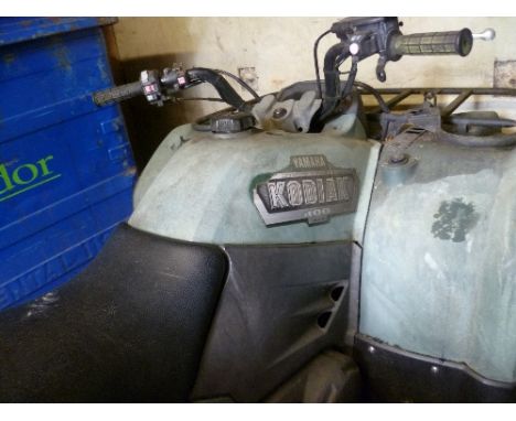 A Yamaha Kodiak 400 4X4 Road Legal Farm Quad Bike ATV.  Please note: we do not offer any guarantee with this item - sold as s