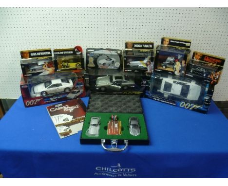James Bond; An Auto Art 1:18 scale die cast model of the Goldfinger Aston Martin DB5, boxed, together with a Joy Ride boxed m