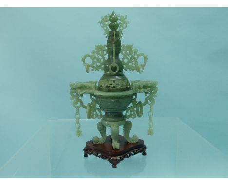 A 20th century Chinese jade Censer and cover, the body of the censor with dragon head handles and rings, on four animalistic 