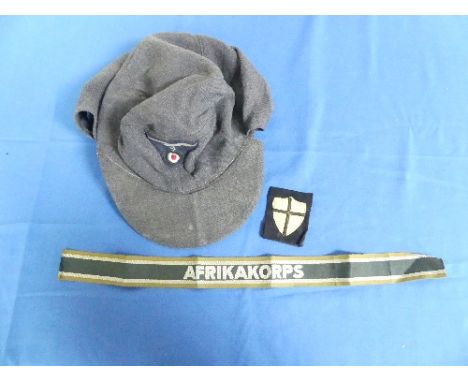 A German Nazi W.W.2 period Luftwaffe Forage Cap, the lining printed "1944 0/0501/0015 57", together with an Afrikakorps embro
