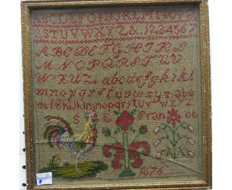 A Victorian Alphabet Sampler, naively stitched in red threads the base with a tapestry cockerel, and stylised plants, signed 