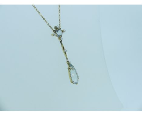 A vintage 15ct yellow gold Pendant, the front with a circular facetted pale blue stone surrounded by four seed pearls suspend