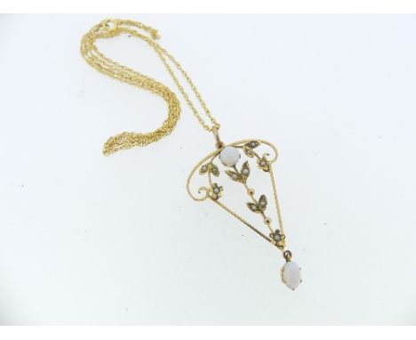 A 9ct yellow gold openwork Pendant, in the Art Nouveau style set with a cabochon opal and seed pearls and with an opal drop b