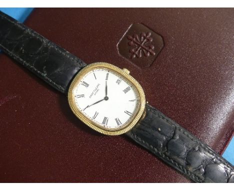A Patek Philippe 18ct yellow gold gentleman's Ellipse Wristwatch, quartz, Ref 3931, circa 1994, the ovoid dial with black Rom