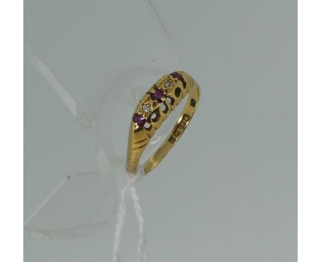 A small ruby and diamond five stone Ring, mounted in 18ct yellow gold, Size Q.