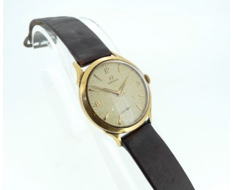 A vintage Omega 18ct gold gentleman's Wristwatch, the circular champagne dial with raised gilt Arabic numerals and baton mark