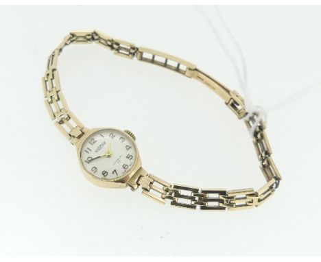 A 9ct gold Roamer lady's Wristwatch, with Swiss 17-jewels movement, the silvered dial with gilt Arabic numerals, on a 9ct gol