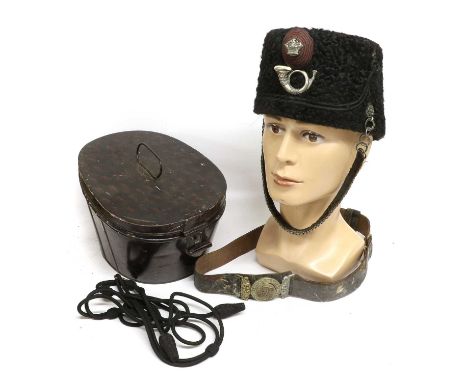 A Victorian Black Persian Lambskin Busby, with plain black cloth crown, red and black corded oval boss plume holder, set with