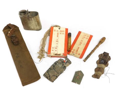 A Selection of Second World War Japanese Army Items, comprising a booklet of wound labels, a bamboo cigarette holder, an ambe