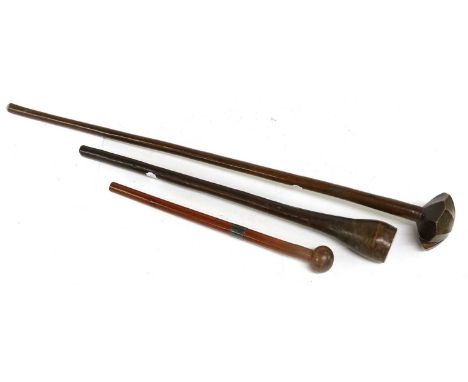 A 19th Century Zulu Knobkerrie, of rich brown patinated hard wood, the facetted mushroom head on a tapering cylindrical haft,
