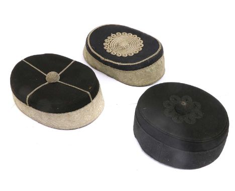 Three Cavalry Undress Pill Box Forage Caps, in black cloth, one with black purl button and lace trim to the crown, with a bla