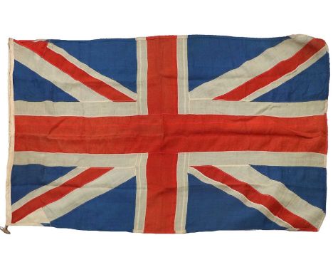 A Military Issue Union Jack, made up of stitched panels of linen, the hoist stencilled with broad arrow, with rope and toggel