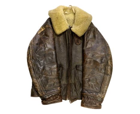 A Second World War US Air Force AN-J-4 Sheepskin Flight Jacket, circa 1943, the two front patch pockets with buttoned flaps, 