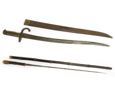 A 19th Century Bamboo Swordstick, the 61cm square tapering steel blade stamped SOLINGEN, with brass collar and root ball pomm