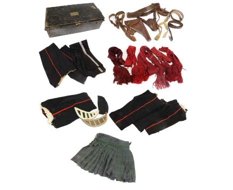 A Quantity of Uniform Parts, including seven pairs of trousers/overalls, five crimson tasselled sashes, a Sam Browne with swo