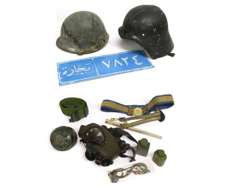 A Small Collection of Iraq War Souvenirs, circa 1991, comprising a Fedayeen helmet, the right side set with correct Arabic ma