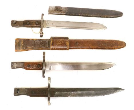 Three Canadian Ross Mk.II Bayonets, each with spear point steel blade, the steel hilt with wood grip scales, one side of the 