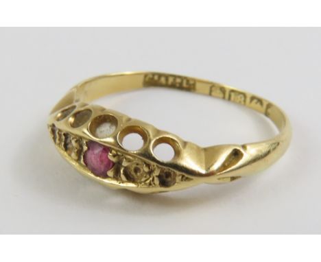 A late 19th or early 20th century 18ct gold ring mount set with a ruby, finger size approximately K, 1.6g gross