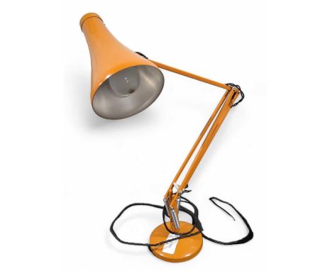 A dark orange anglepoise lamp