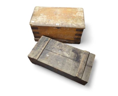 Two pine trunks one containing some wood working tools
