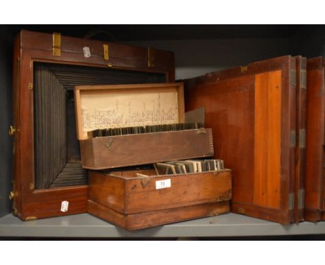 A Victorian mahogany field camera a large collection of plates and glass slides of mixed interest including Balmoral Castle, 